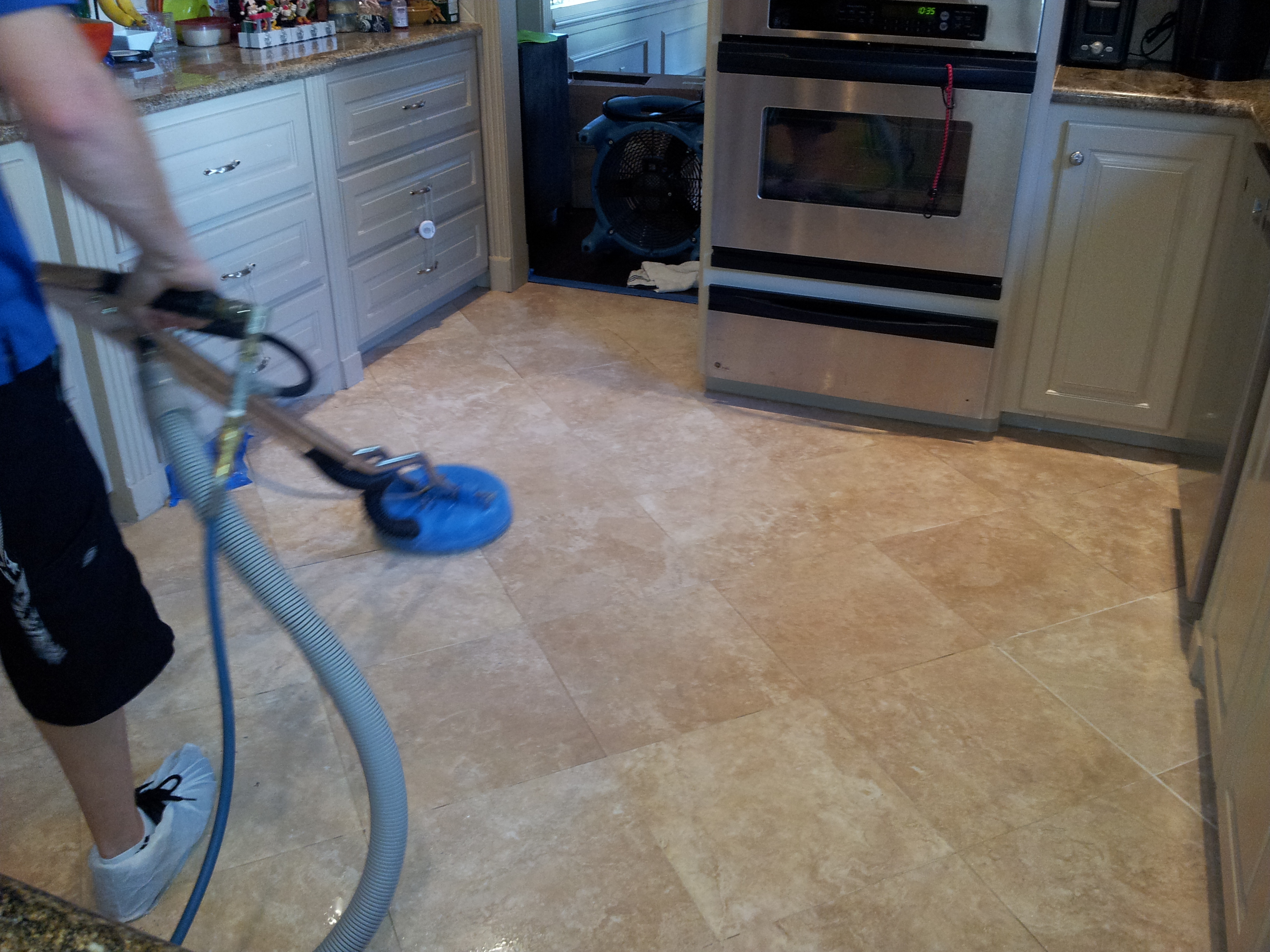 Techician Cleaning Travertine Floor